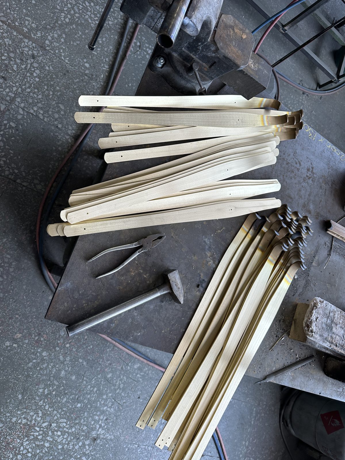 Cut brass strips, ready for shaping