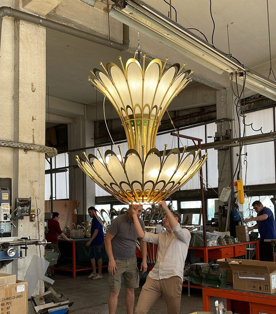 Assembled Art Nouveau chandelier, suspended in the workshop