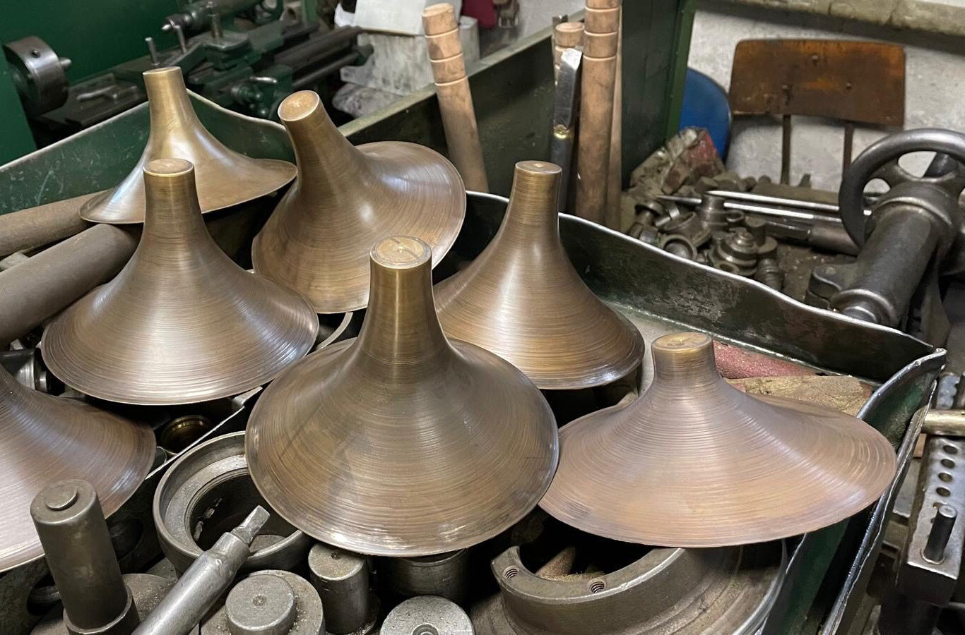 Turned brass cones on the workbench