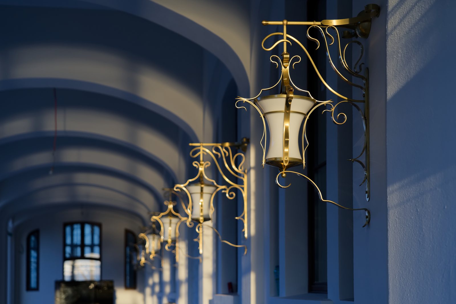 A row of Art Nouveau brass lanterns on the Casino's outer arcades, at sunset
