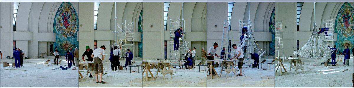 Site collage: the FD.STIL team raising the stainless steel frame of the chandelier on scaffolding, in the still-unfinished cathedral in Iași