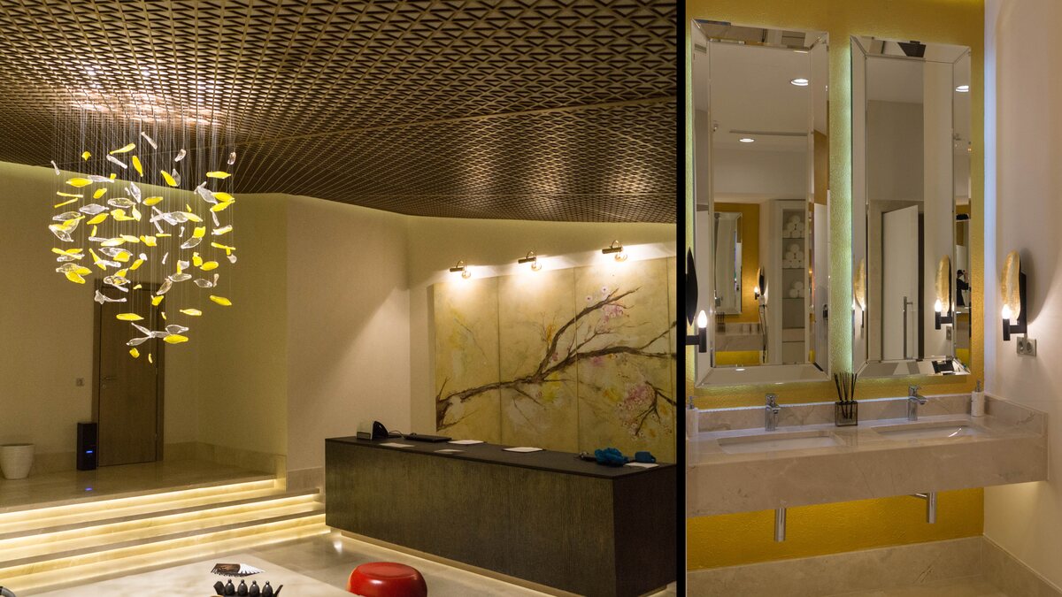 The Shiseido Spa reception at Stejarii Country Club, with the suspended ornament of yellow and white glass leaves made by FD.STIL, and the changing room with its mirrors and wall lights