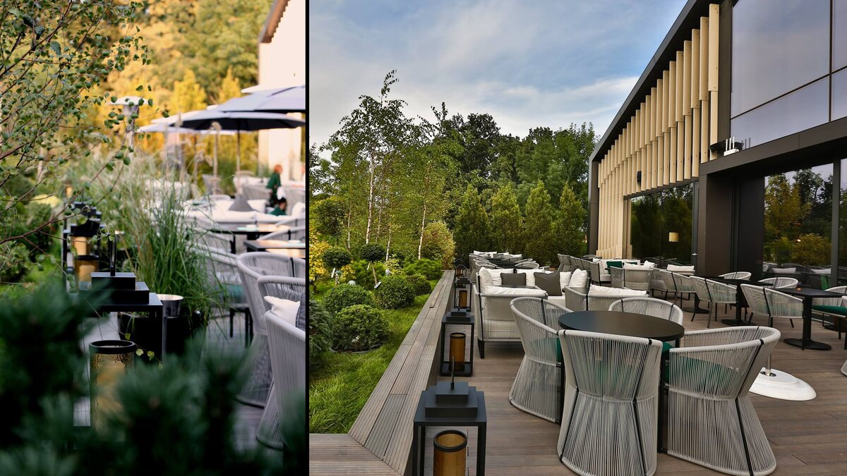 The restaurant terrace at Stejarii Country Club, with the black FD.STIL lanterns set on the timber kerb, between the planters and the woven armchairs